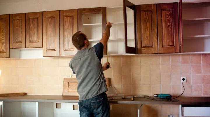 How do you clean sticky kitchen cabinets?