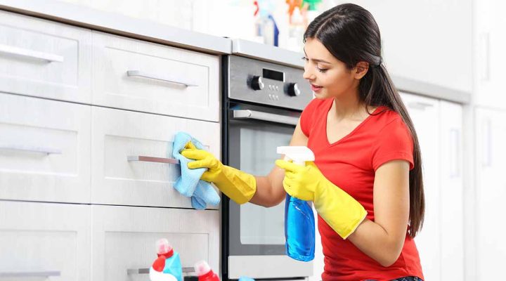 How do you remove oil from kitchen cabinets?